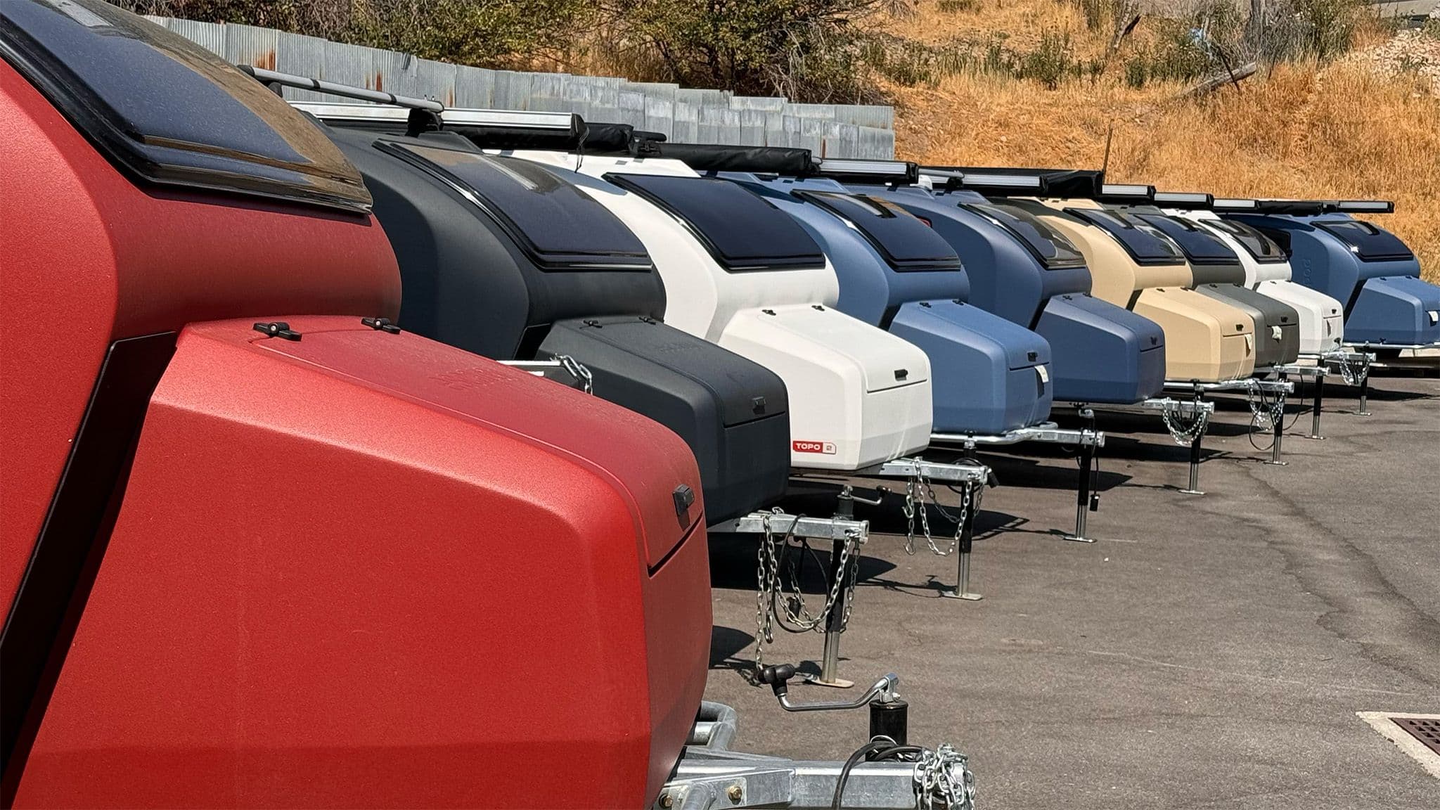 A row of Escapod TOPO2s in various colors on display at their factory in Coalville, Utah.